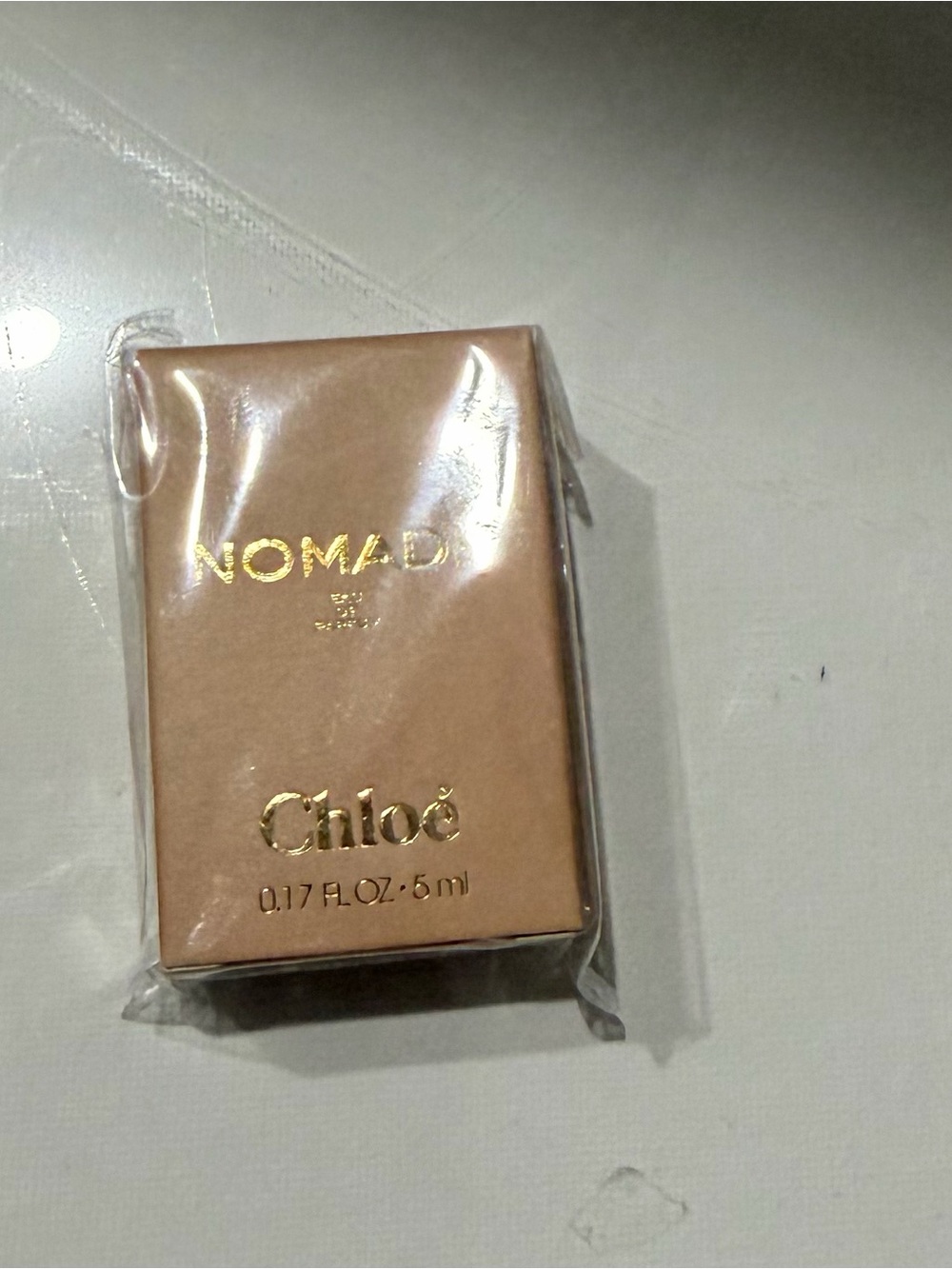 Others Follow Nomade Mini Perfume in Beige with Gold Accents